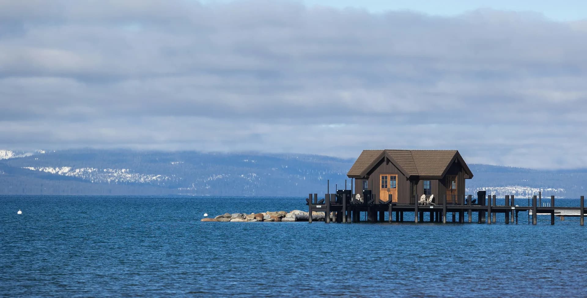 A boathouse pier over Lake Tahoe in winter