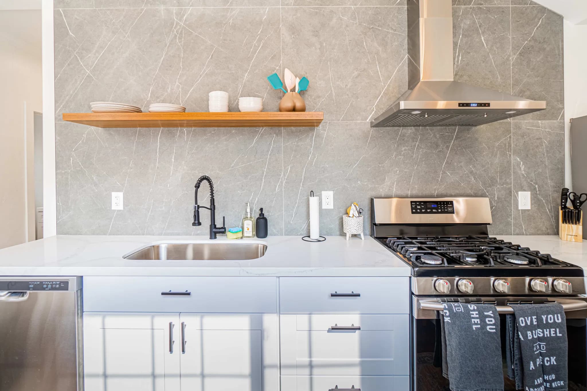 Marble and quartz kitchen detail in a managed luxury home